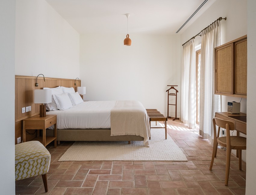 Inviting guest room with comfortable bedding and natural materials