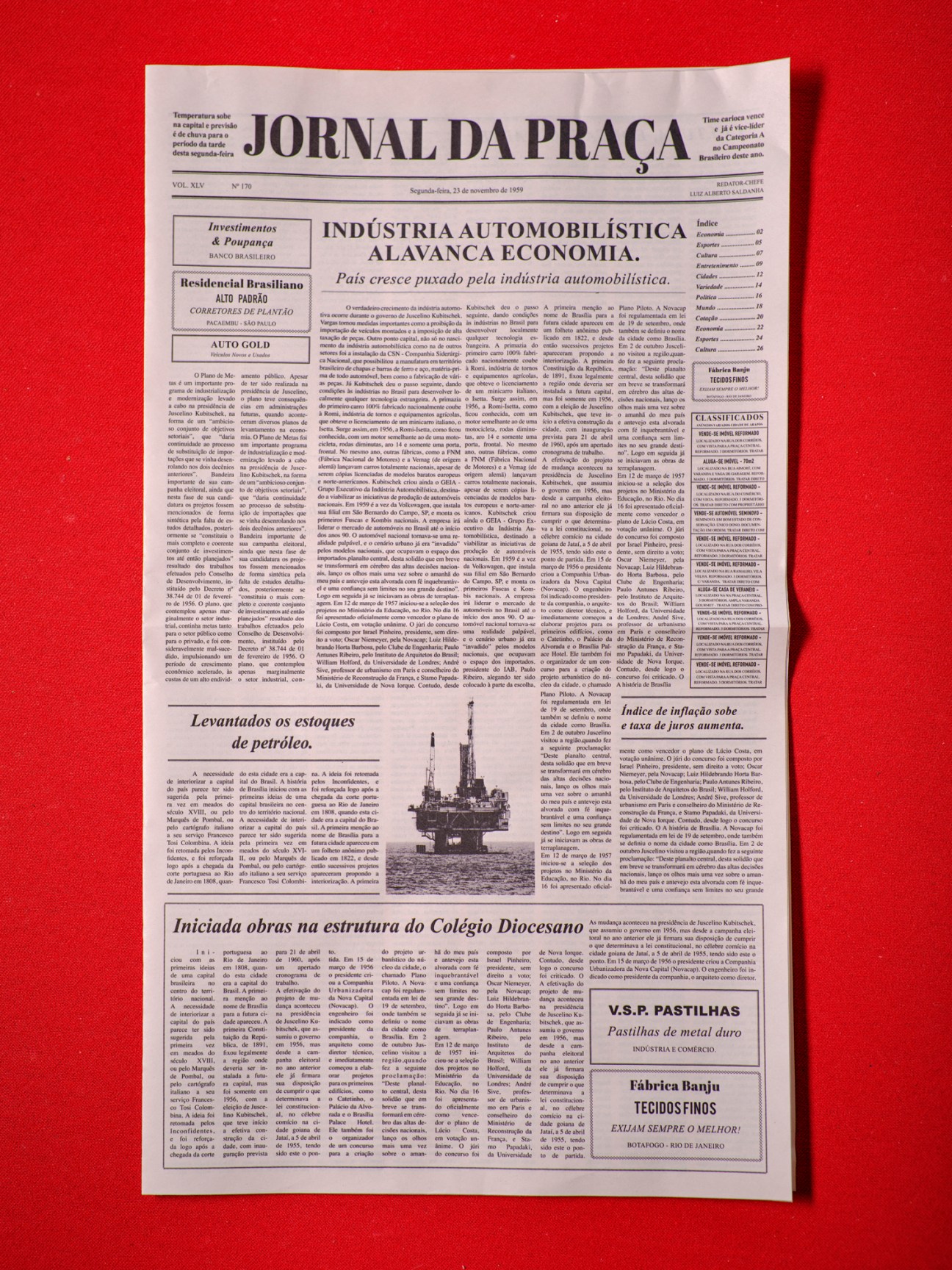 Portuguese newspaper 'Jornal da Praça' with automotive industry headline and classified ads section