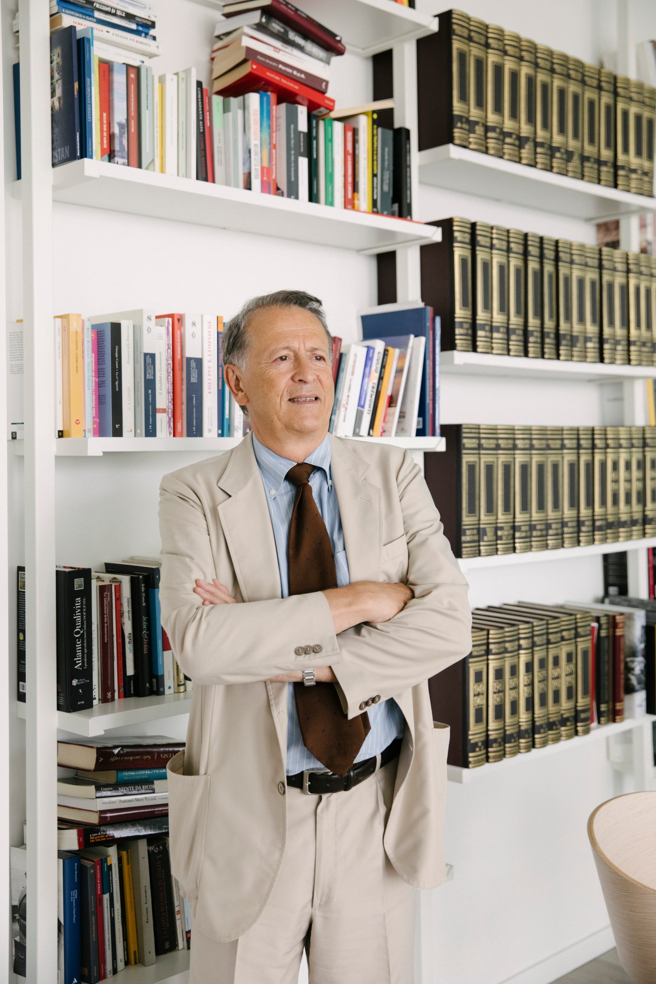 Editor in chief Fabio Tamburini standing in modern office with bookshelves