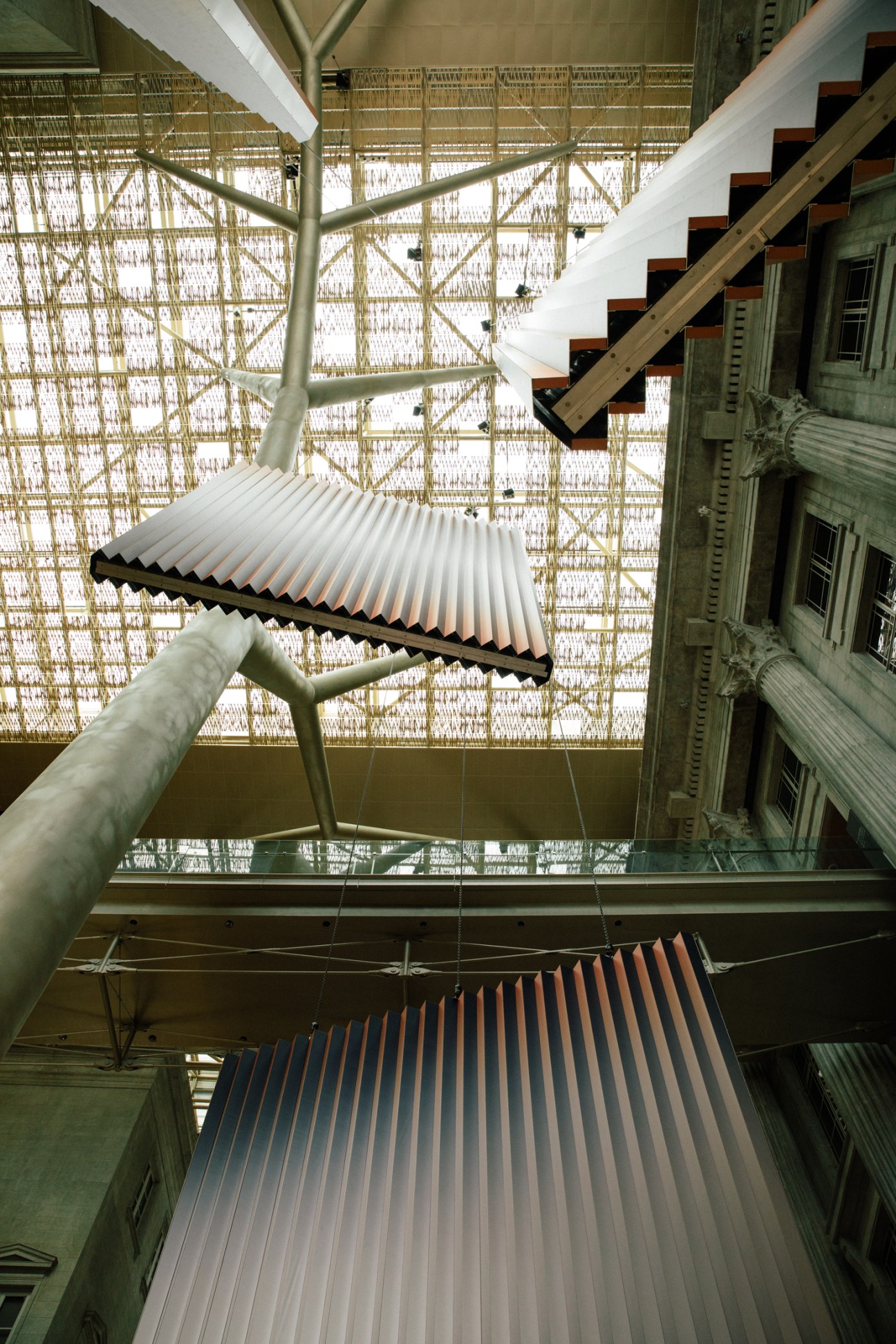 Dawn Ng's large-scale gradient installation displayed in the bright atrium space of National Gallery Singapore