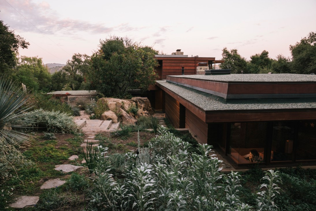 Modernist Anderson House by W Earl Wear nestled among boulders and vegetation in Topanga Canyon.