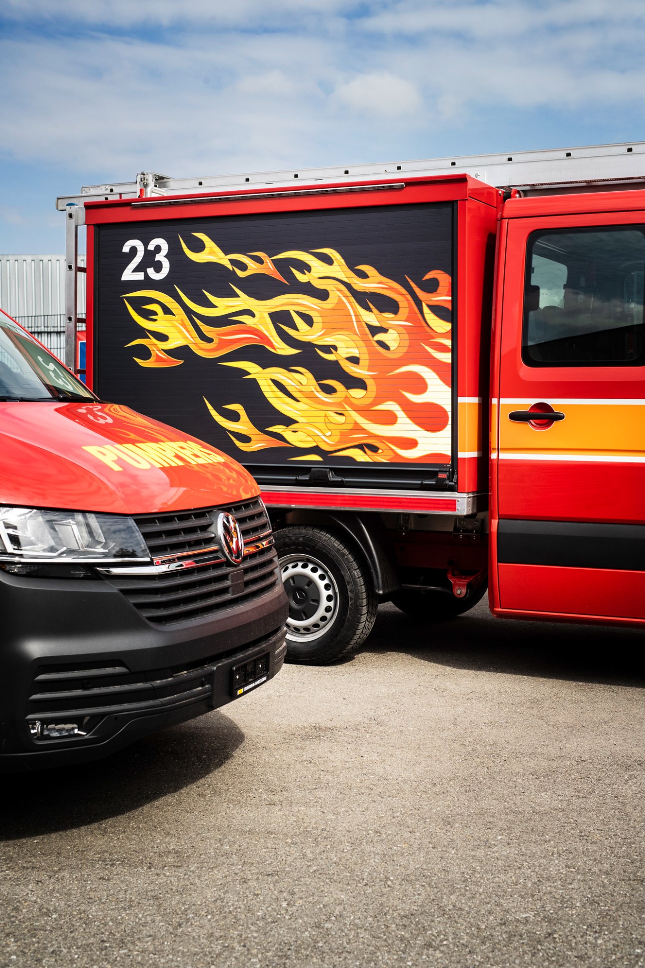 Side view of a sleek red Brändle fire engine showing its modern design aesthetic