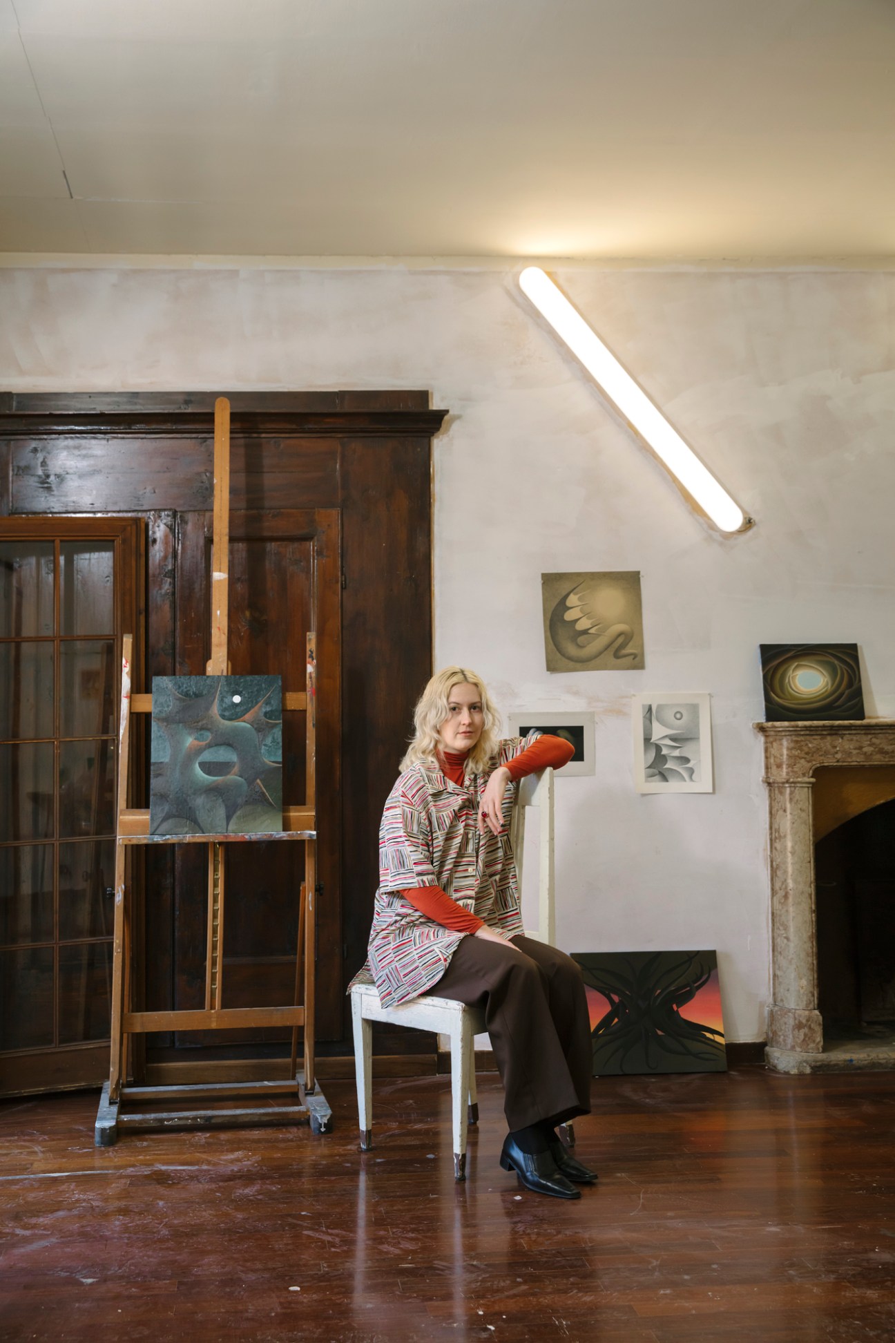 Portrait of painter Alicia Adamerovich in her temporary studio space at Palazzo Monti