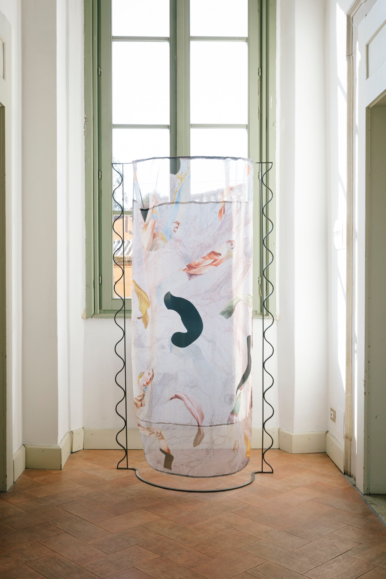 Contemporary cylindrical room divider by Ilaria Bianchi with abstract painted design in historic palazzo interior