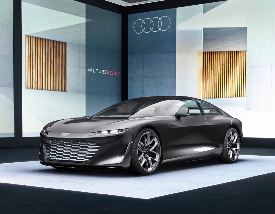 Audi's Grandsphere concept car on display at a motor show with the brand logo and #FUTUREREADY signage visible