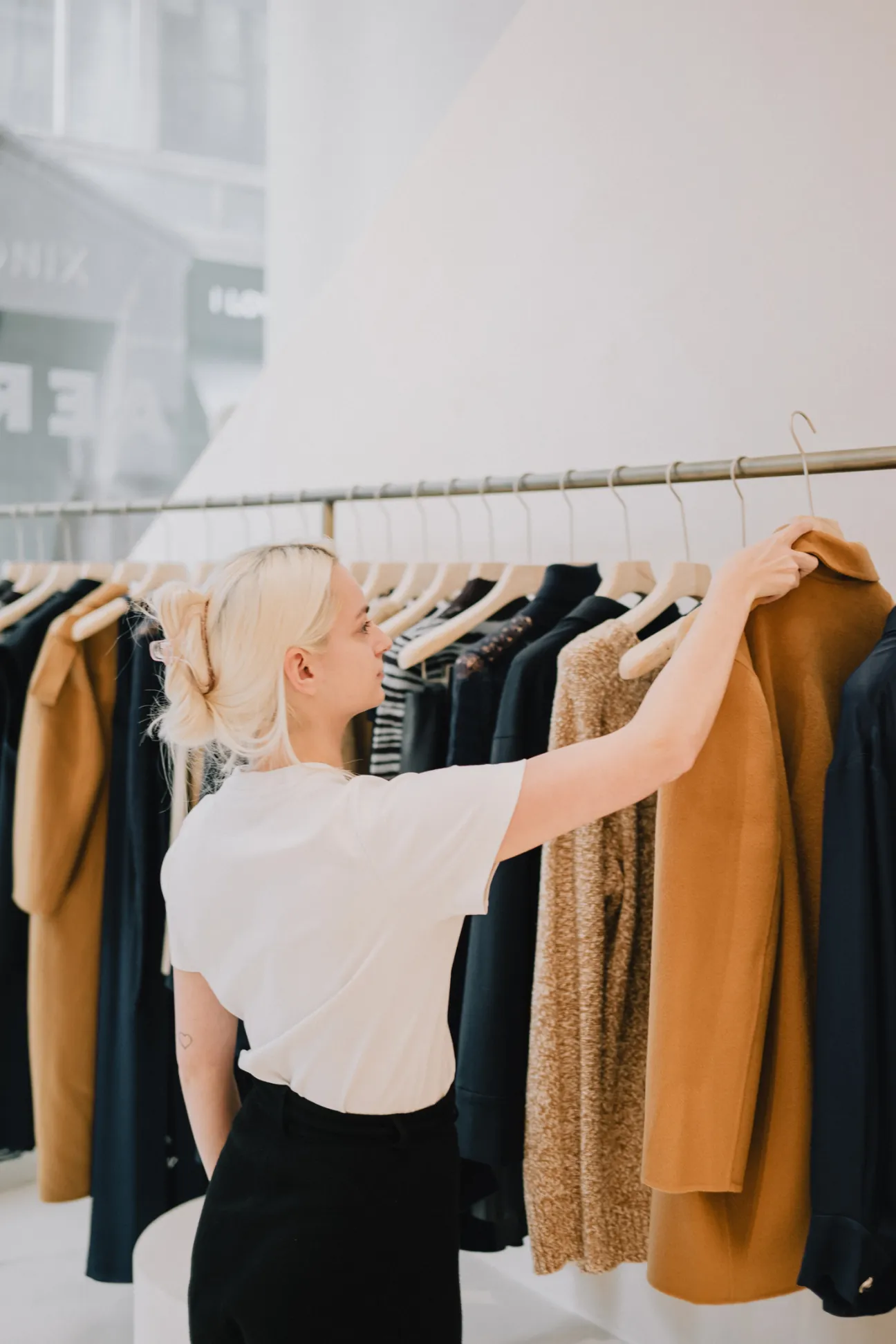 Interior of Aeron fashion boutique showing signature blazers and suits