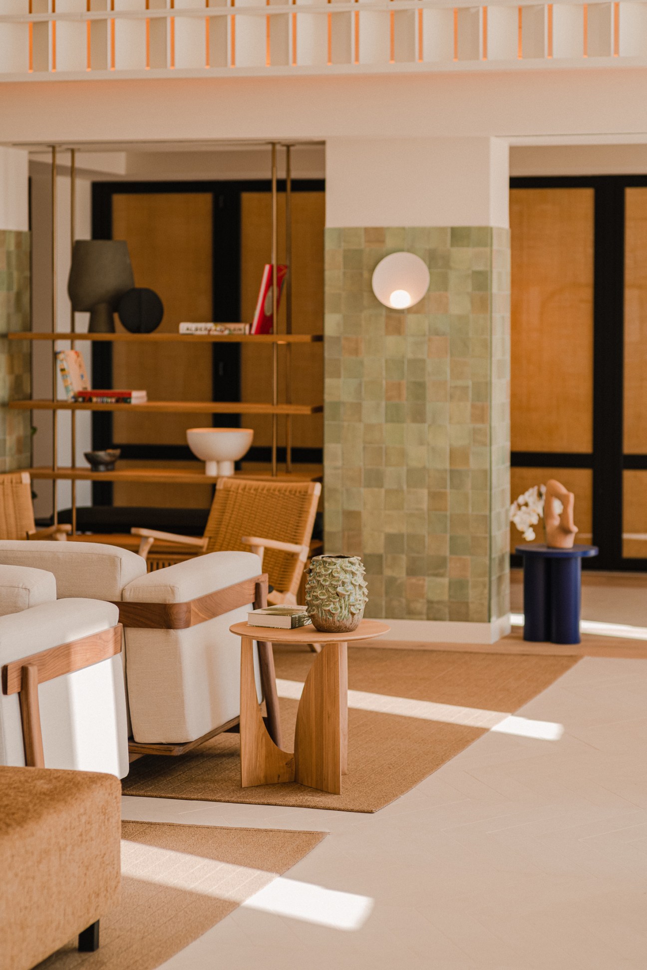 Aethos Ericeira lobby lounge area with modern furniture and warm lighting providing space for guests to relax