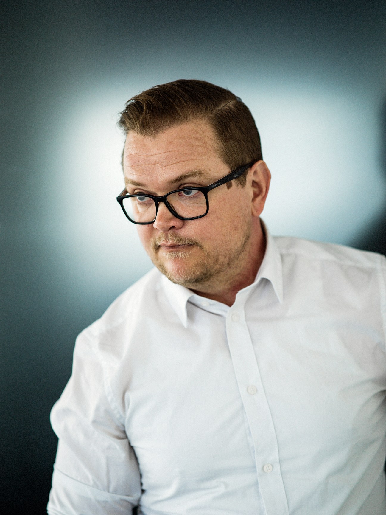 Johan Segertoft, programme director for the Gripen E, in white shirt and glasses at Saab facility