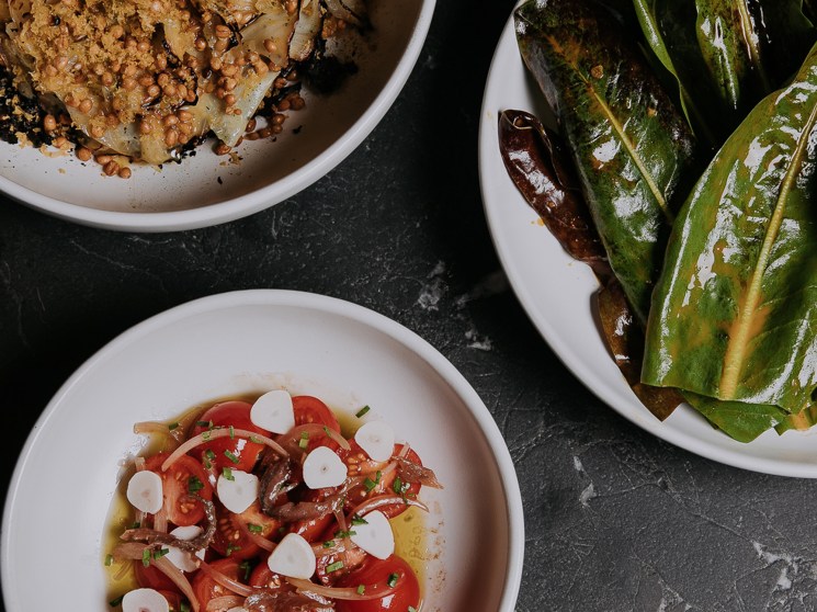 Agnes restaurant's wood-fired kitchen and dining area in Brisbane's listed warehouse