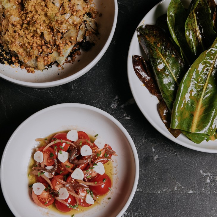 Agnes restaurant's wood-fired kitchen and dining area in Brisbane's listed warehouse