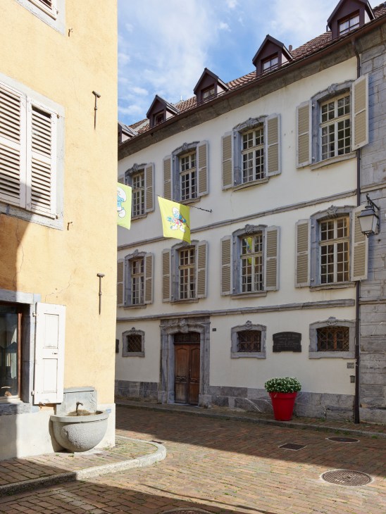 Cobblestone street in Saint-Maurice showing traditional Swiss town architecture