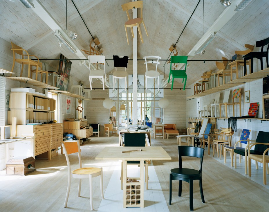 Interior view of Axelsson's studio showing handcrafted furniture pieces and tools used in his 60-year career