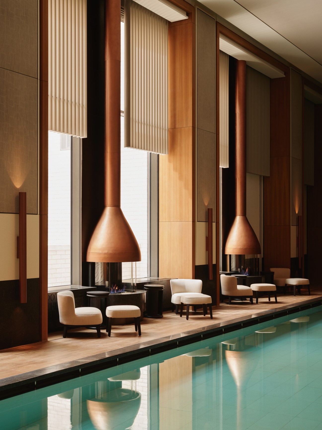 Aman New York's 20-metre swimming pool in the spa area with modern design and natural lighting