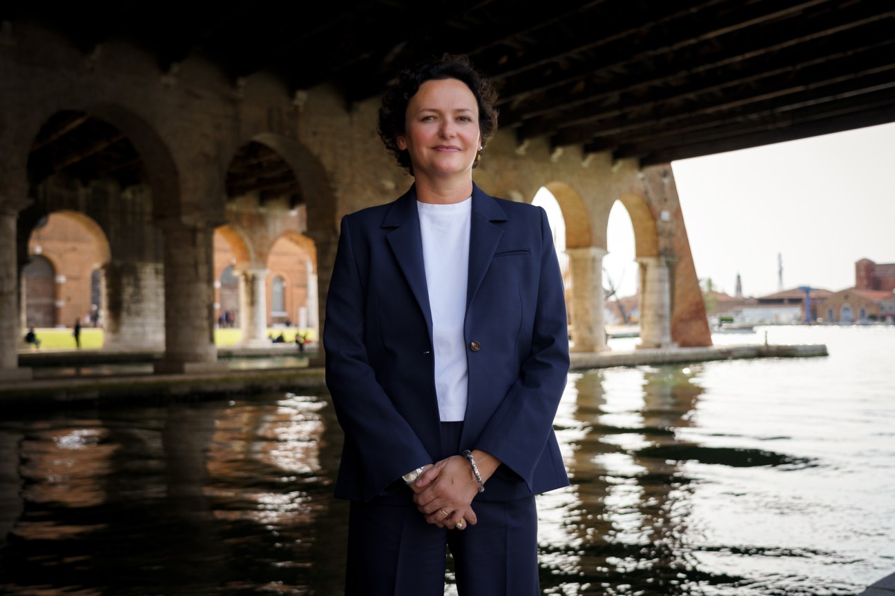 Cecilia Alemani, curator of the 59th Venice Biennale, standing in gallery space