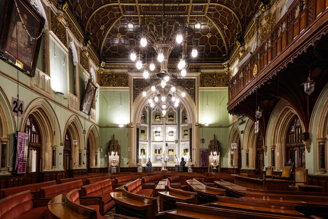 Interior view of Mumbai's BMC Council Chamber showing restored architectural details and seating arrangement