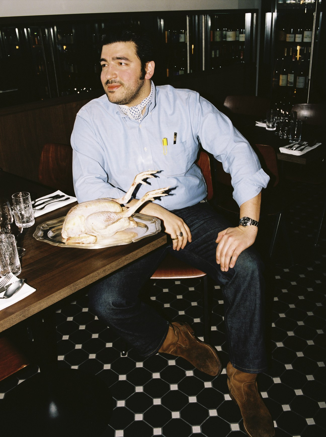 Pierre Touitou wears shirt and jeans by Brooks Brothers, shoes by La Botte Gardiane, cravatte and watch model’s own