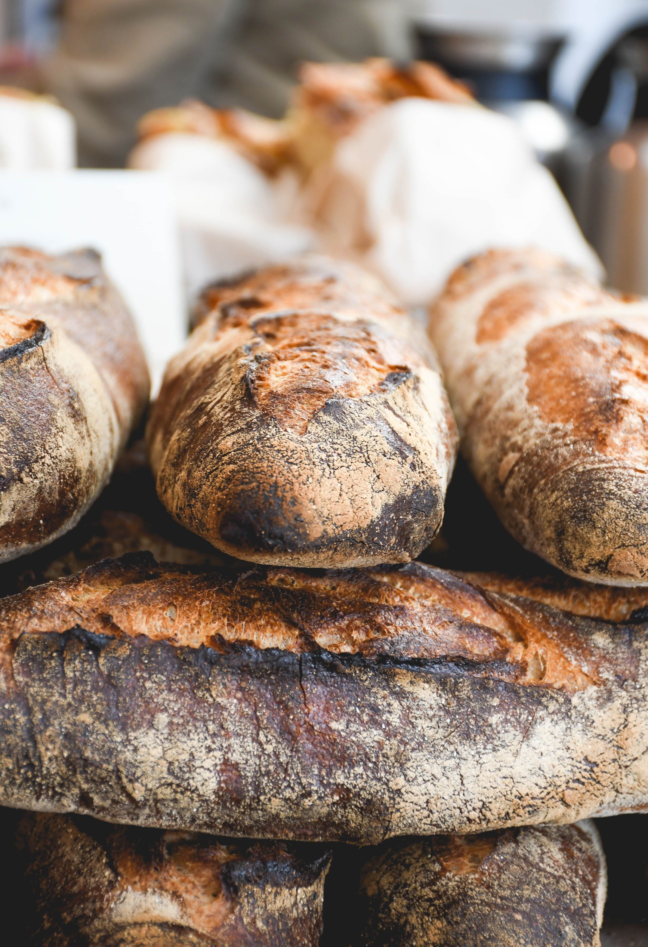 Fresh artisan bread loaves with crusty surfaces displayed at RPM Bakehouse