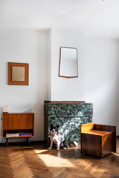 Decorative faux fireplace made with terrazzo and glazed tiles, designed to create ambiance without functional heating