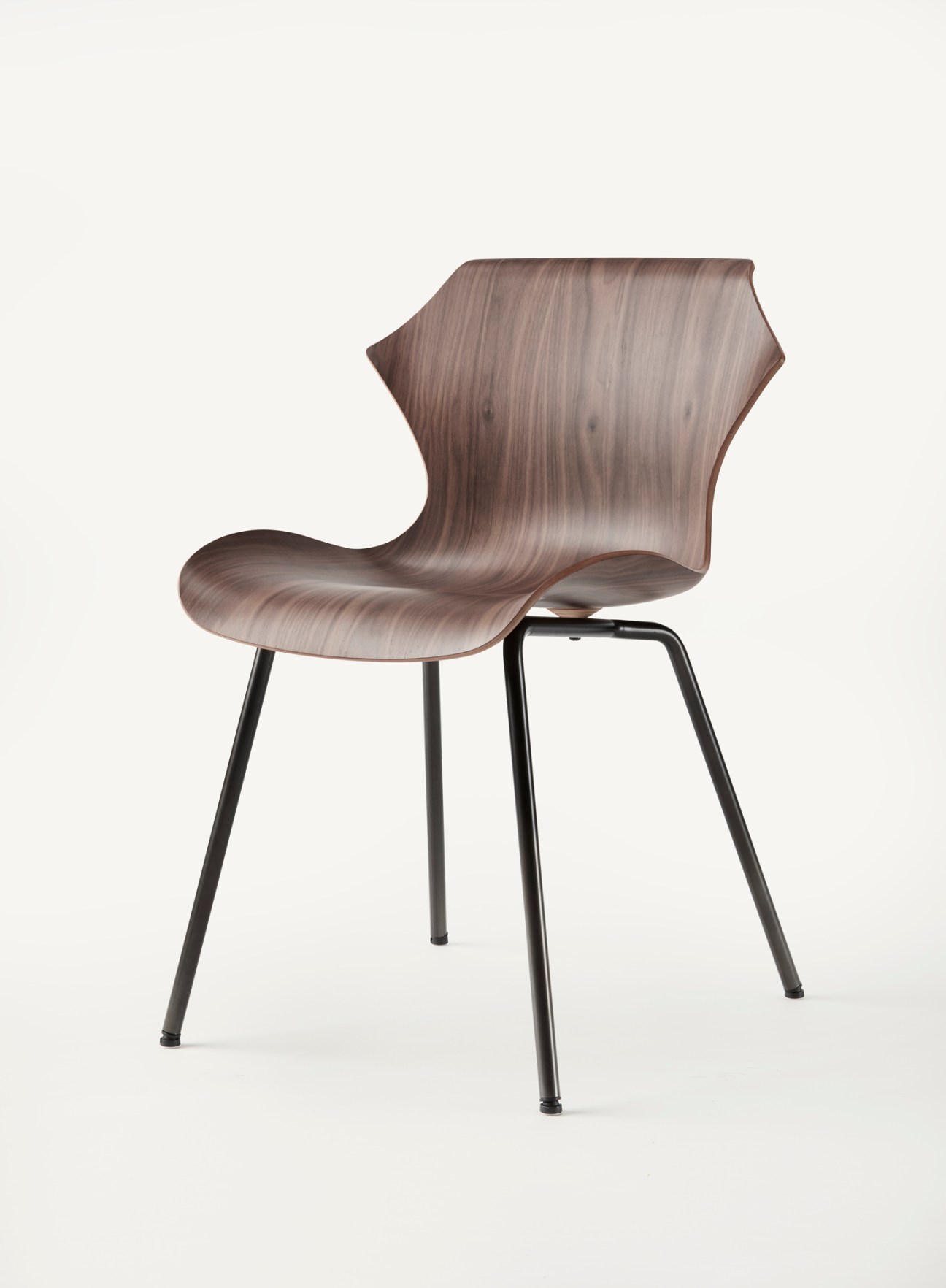 BassamFellows Petal chair in walnut with curved molded plywood seat and black metal legs