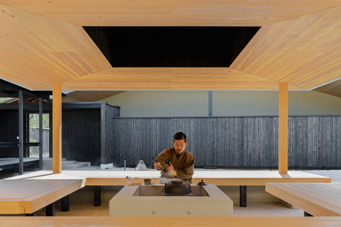 Roka owner Shintaro Sasaki performing tea ceremony in traditional Japanese interior with wood beams and tatami