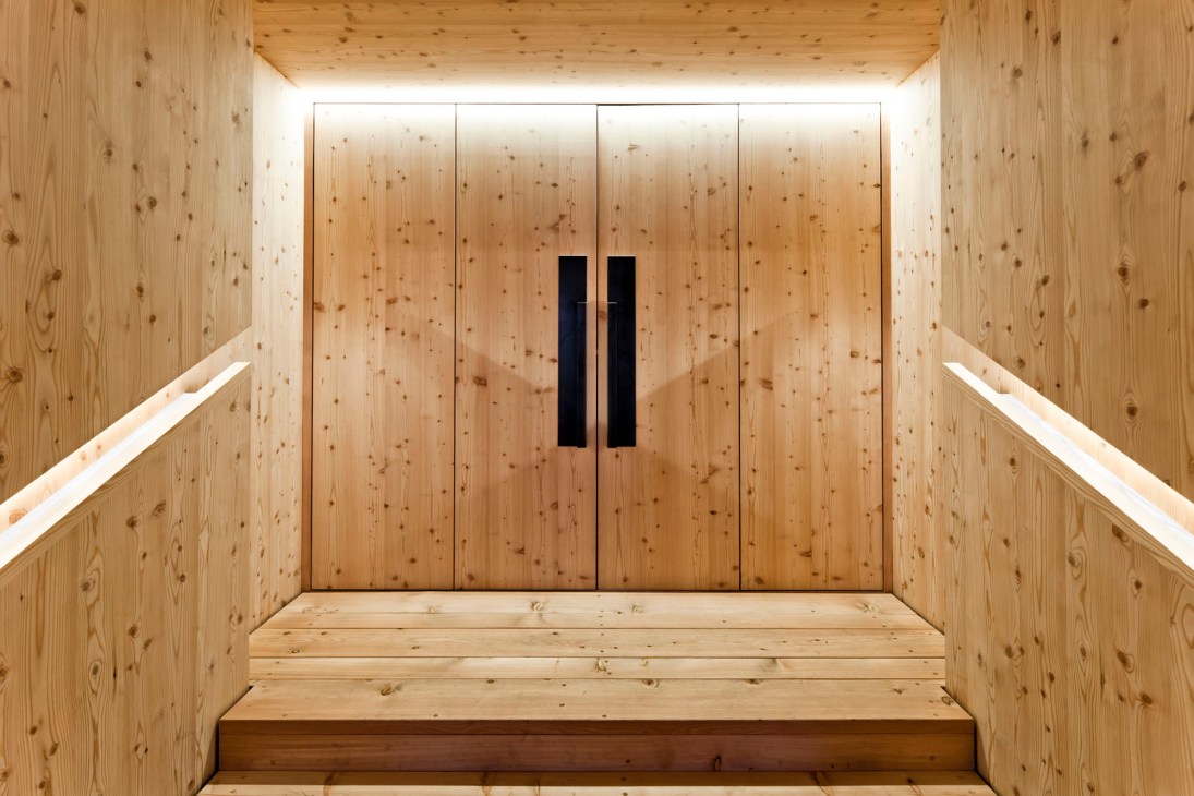 Modern timber building exterior with traditional Alpine proportions and contemporary architectural details