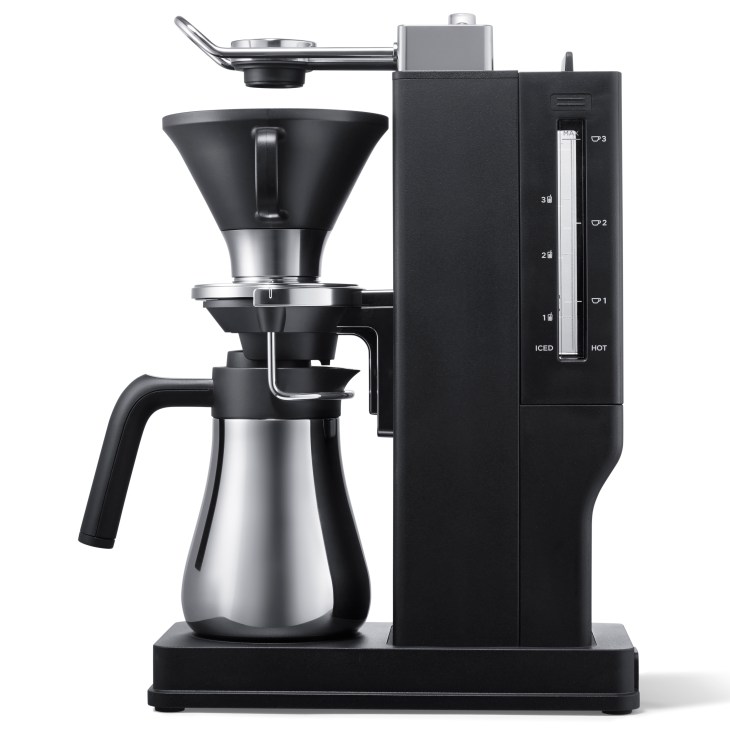 Sleek matte-black Balmuda The Brew drip coffee maker with chrome accents on dark background