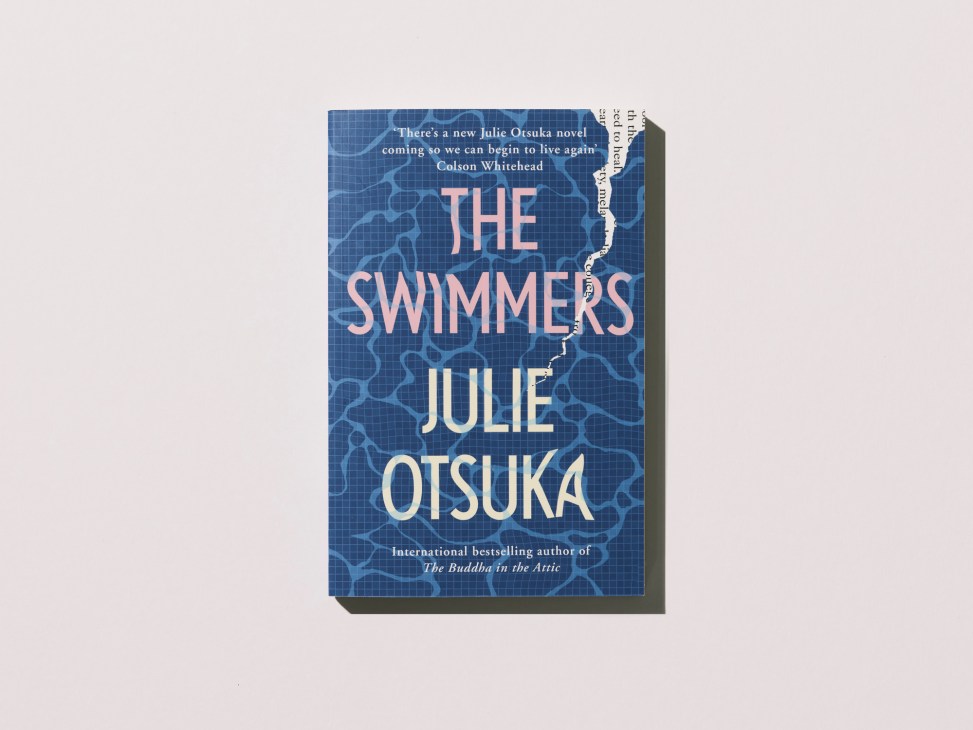 Book cover of The Swimmers by Julie Otsuka with blue water-rippled background and coral-pink title text