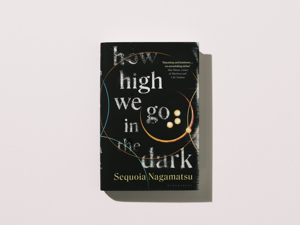 Book cover of How High We Go in the Dark by Sequoia Nagamatsu with black cover and colorful circular design
