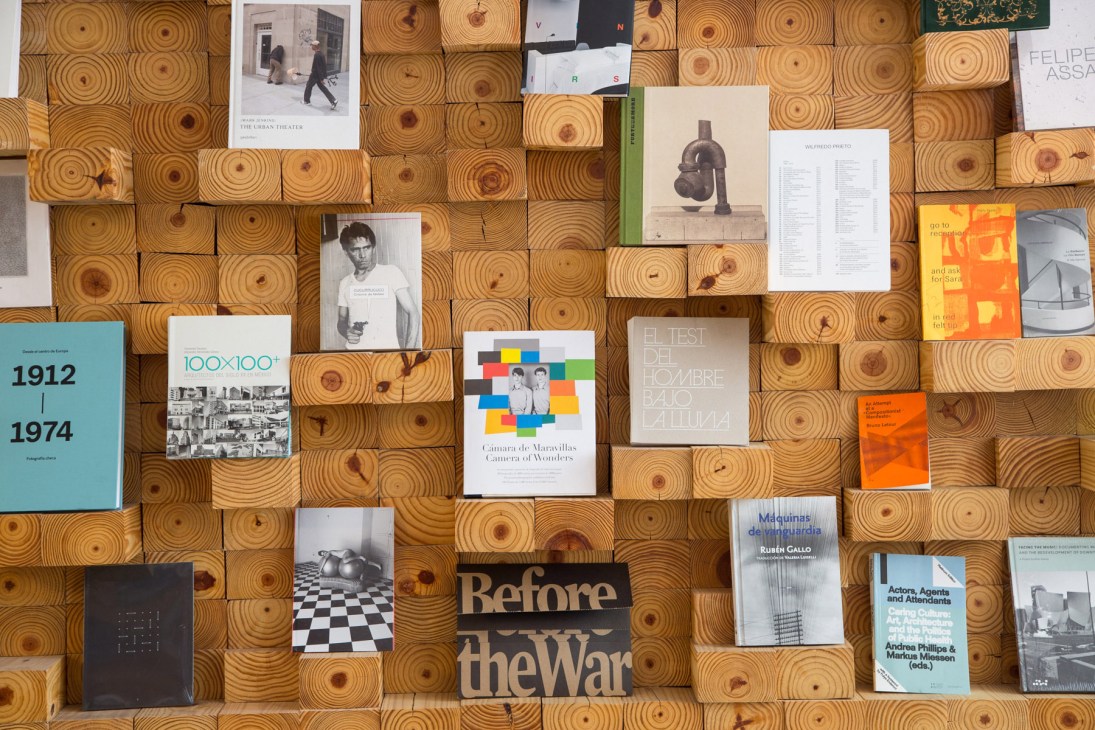 Display of art books and magazines on wooden circular shelving at Casa Bosques shop.
