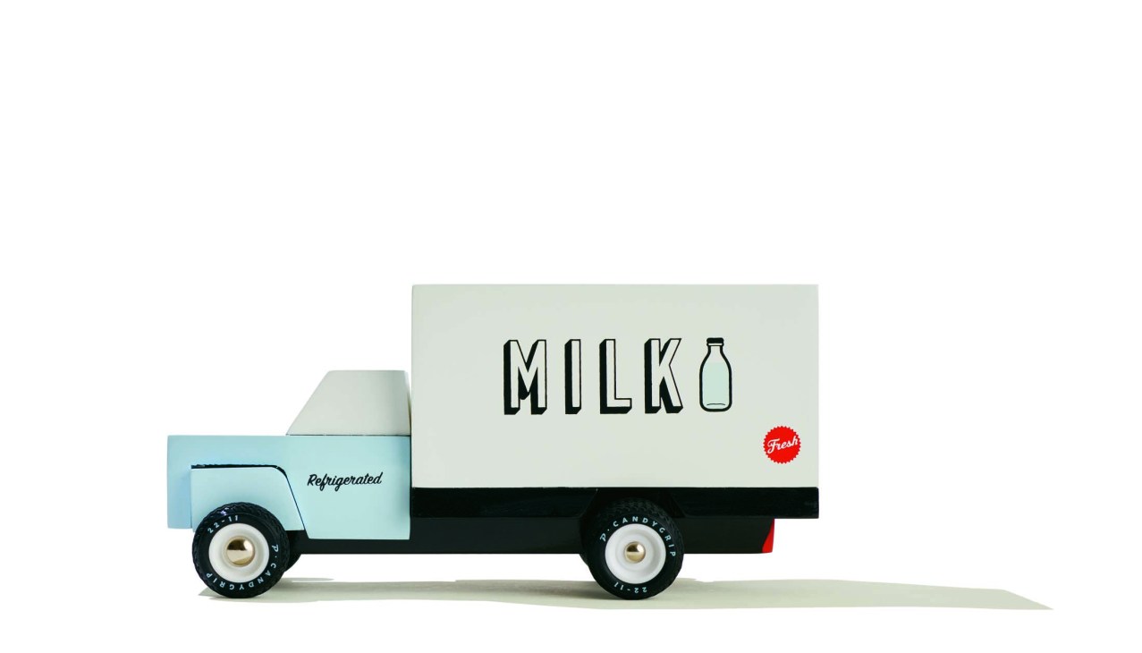 Wooden toy milk delivery truck by Candylab Toys in light blue and cream colours