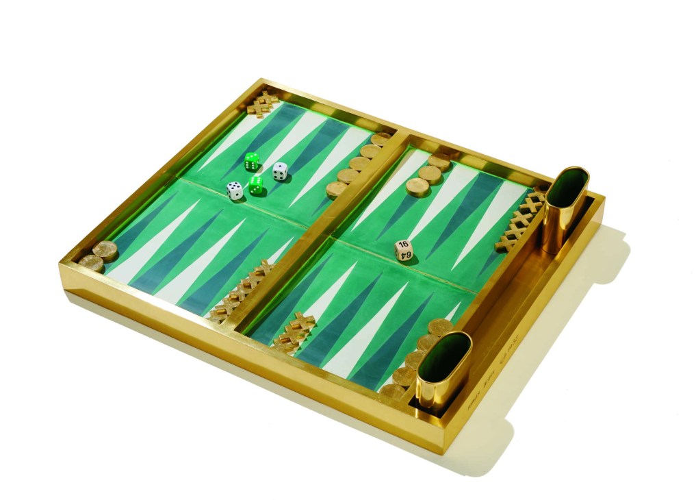 Brass-framed backgammon board with green playing surface, wooden pieces, and dice by Popham