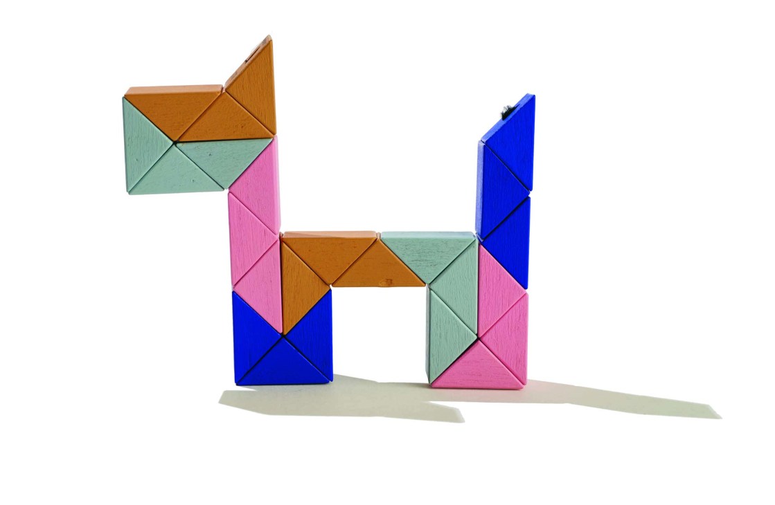Snake block wooden toy twisted into a dog shape by Areaware