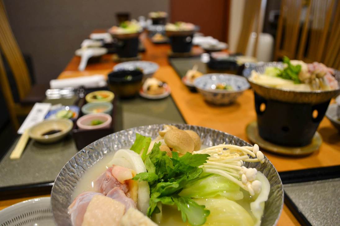 A bowl of Hakata ramen with noodles, broth, and toppings at a Fukuoka restaurant.
