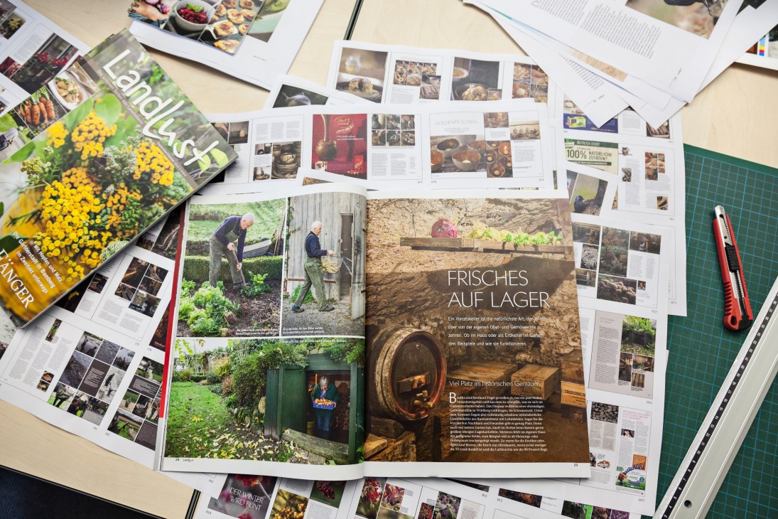 Monocle magazine spreads and pages displaying agricultural and rural lifestyle articles and photography laid out on a work surface.