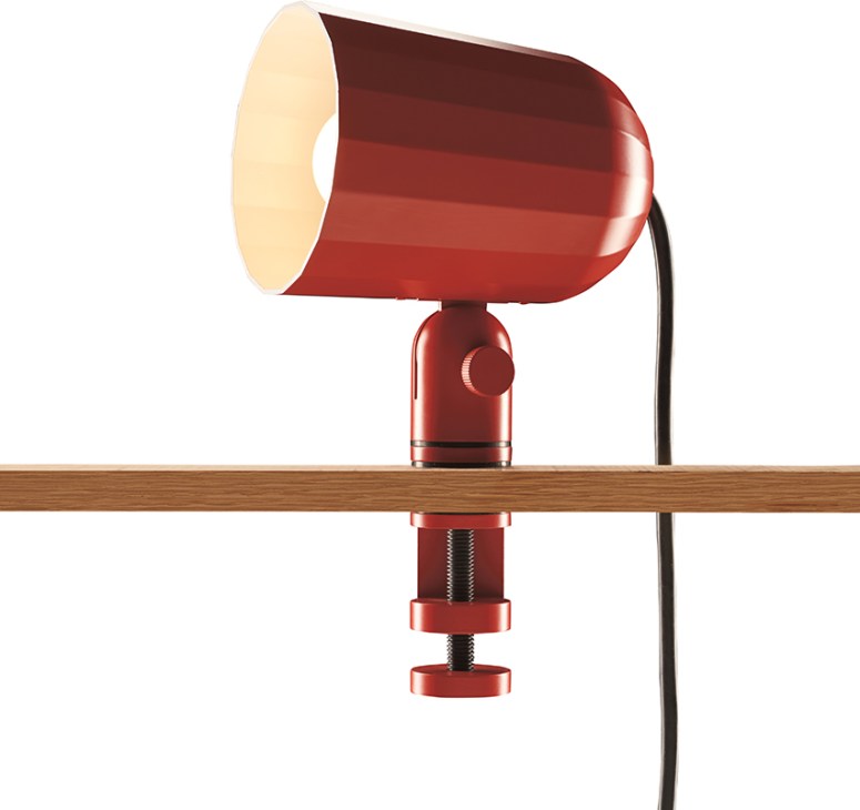 Red stainless steel spherical Flowerpot table lamp by Verner Panton clamped to wooden shelf.