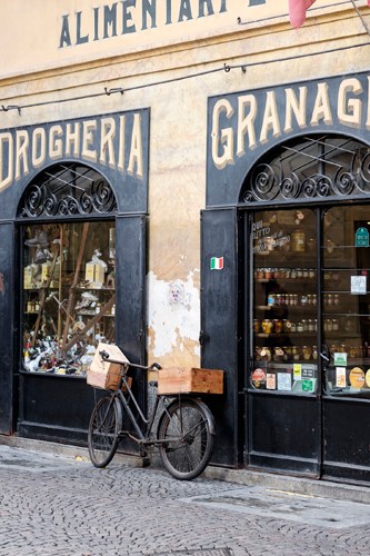 Interior of Ciapponi grocery store in Morbegno showing traditional wooden shelves and Italian products