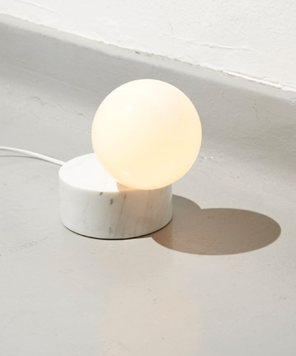 Litho light by Vormen, spherical stone sculpture on terrazzo pedestal