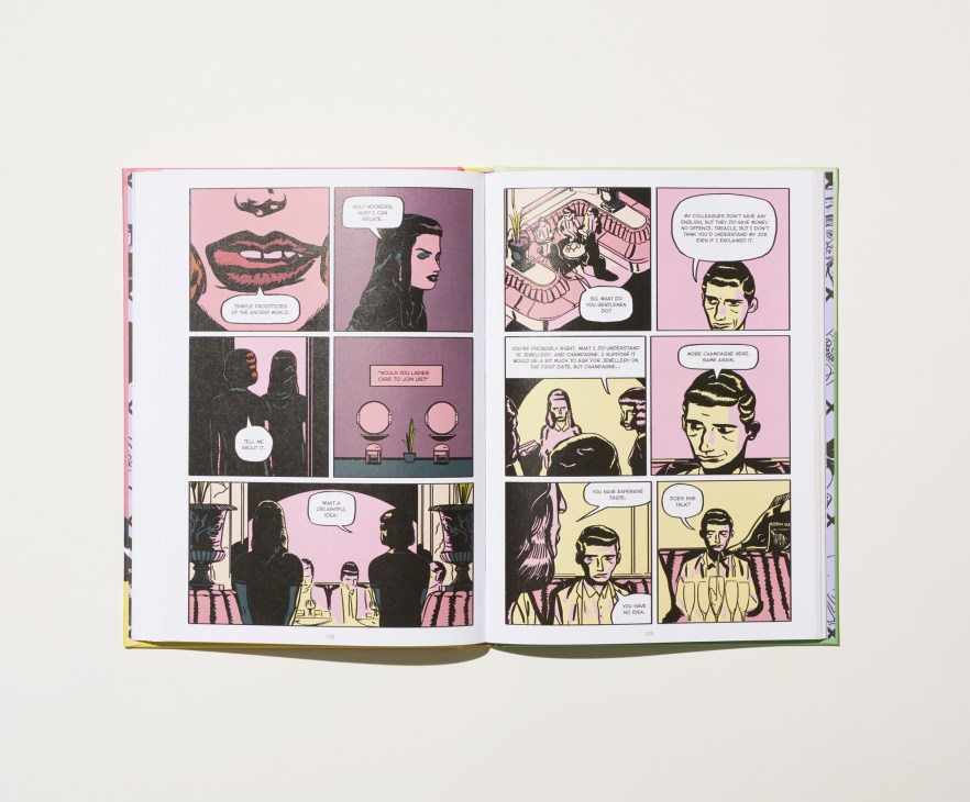 Open comic book pages with colorful illustrations showing characters in dialogue and narrative scenes