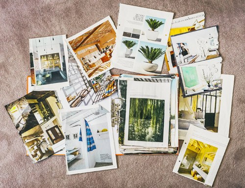 Collection of scrapbooks and inspiration materials including architectural photos and design clippings.