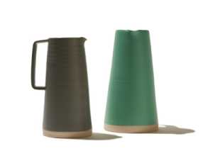 Two ceramic pitchers with natural clay bases in olive green and sage green from Arran Street East's 2018 Skyline collection.