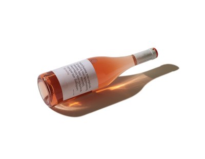 Bottle of Liastos rosé wine from Limnos, Greece with fresh-flavoured rose-hued liquid
