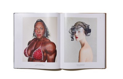 Open photography book displaying two portrait photographs side by side.