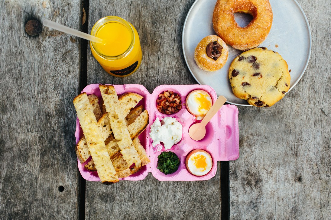 Breakfast spread with toast soldiers, soft-boiled eggs, and pastries from Paddock Bakery