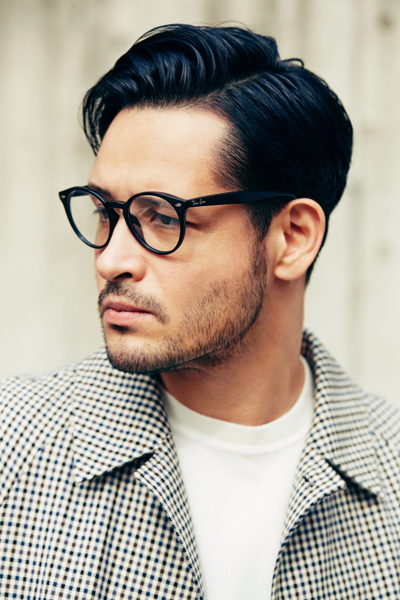 Man wearing Sealup coat, A Kind of Guise T-shirt, Ray-Ban glasses, styled for spring.