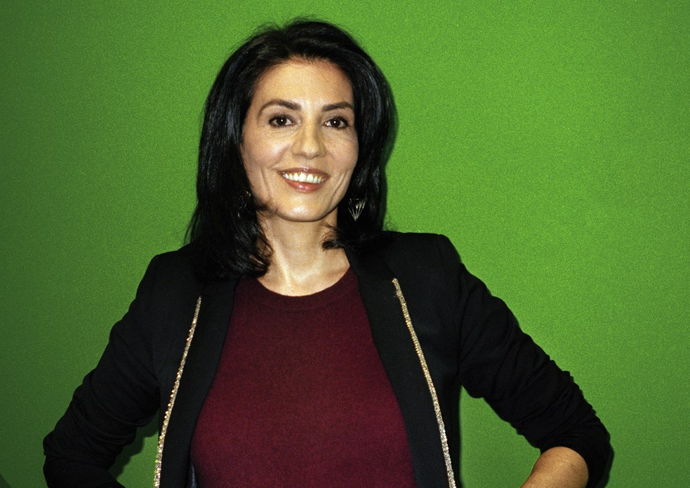 Sophie Claudet, deputy editor in chief of magazines at Euronews, smiling against a green background.
