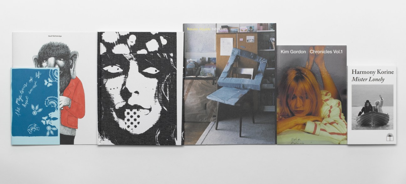 Collection of Nieves published books displayed in a row, including titles by Geoff McFetridge, Kim Gordon, and Harmony Korine.
