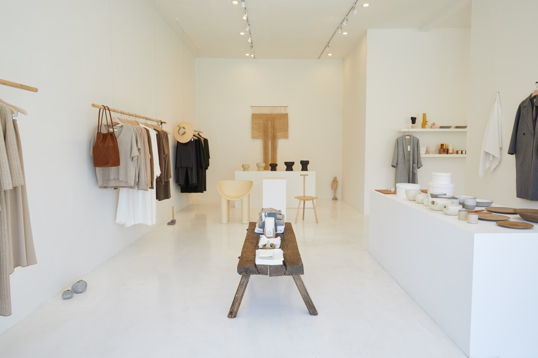 Minimalist retail interior of Arch The boutique in Los Angeles with clothing displays and gallery-style setup.