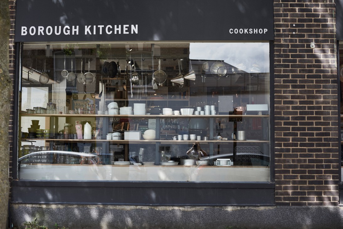 Storefront of Borough Kitchen cookshop with large windows displaying kitchen equipment and cookware on shelves