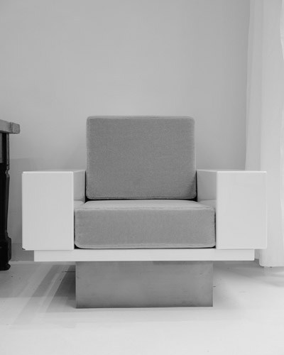 Modern grey and white upholstered chair with clean lines and geometric design by Pierre Augustin Rose.