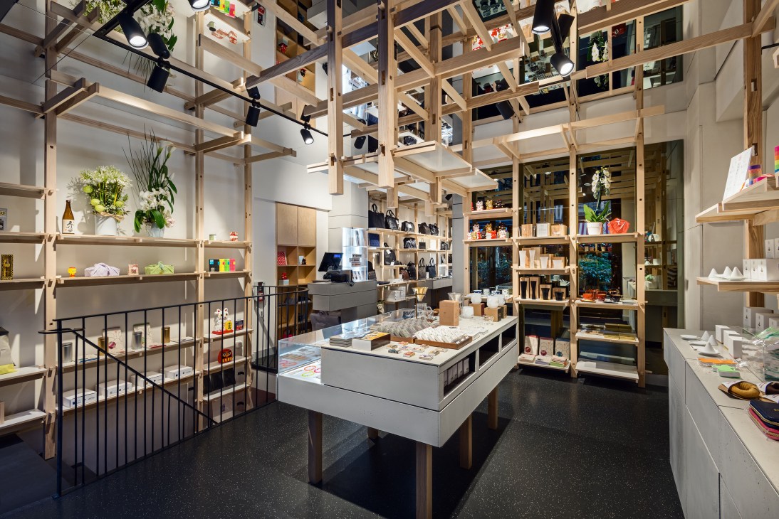 Mark'style Tokyo retail shop interior in Paris with wooden shelving, stationery displays, and minimalist design.